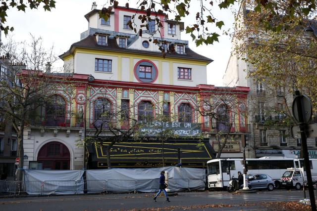 A woman walks past the Bataclan Theater in Paris where at least 82 people were killed during coordinated attacks on November 13. (AFP) A woman walks past the Bataclan Theater in Paris where at least 82 people were killed during coordinated attacks on November 13. (AFP)