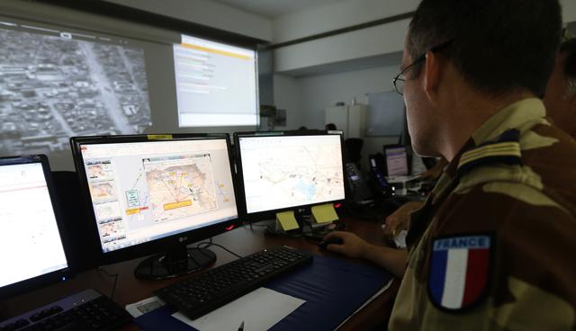 French soldiers sit in a control room at a French military base at an undisclosed location in the Gulf on November 17, 2015, as they monitor operations against the Islamic State group in Syria and Iraq. (AFP) French soldiers sit in a control room at a French military base at an undisclosed location in the Gulf on November 17, 2015, as they monitor operations against the Islamic State group in Syria and Iraq. (AFP)