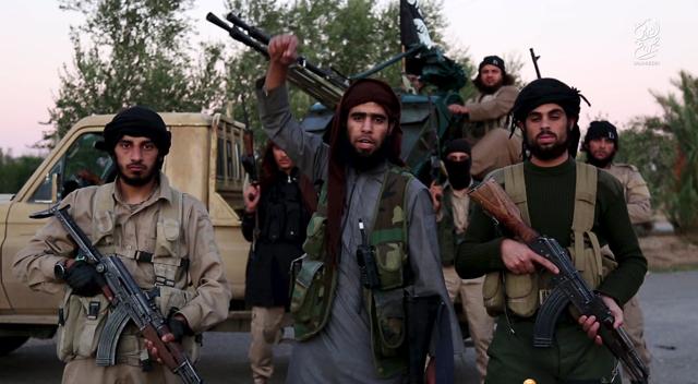 A man (C) identified in the subtitiles as Al Karar the Iraqi warned in a new video released by IS on November 16, 2015 that countries taking part in air strikes against Syria would suffer the same fate as France, and threatened to attack in Washington. (REUTERS) A man (C) identified in the subtitiles as Al Karar the Iraqi warned in a new video released by IS on November 16, 2015 that countries taking part in air strikes against Syria would suffer the same fate as France, and threatened to attack in Washington. (REUTERS)