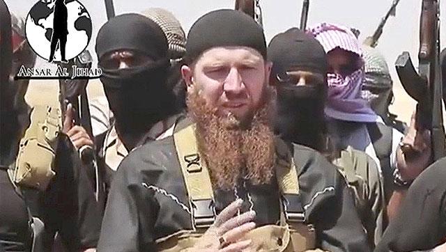 This image made from an undated video on a social media account frequently used for communications by the Islamic State shows Omar al Shishani standing next to the group s spokesperson among a group of fighters as they declare the elimination of the border between Iraq and Syria. (AP File Photo) This image made from an undated video on a social media account frequently used for communications by the Islamic State shows Omar al Shishani standing next to the group s spokesperson among a group of fighters as they declare the elimination of the border between Iraq and Syria. (AP File Photo)