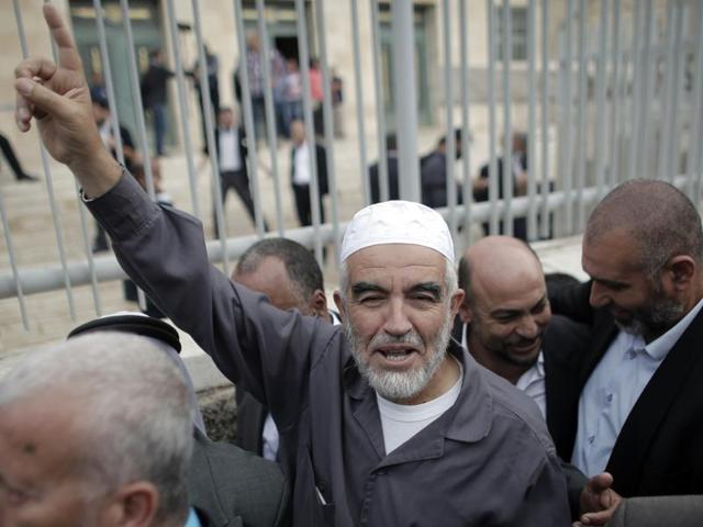 A file photo shows Raed Salah, head of the radical northern wing of the Islamic Movement in Israel, gesturing outside a Jerusalem court after he was convicted. Israel banned the radical wing of the Islamic Movement, accusing it of fomenting violence at Jerusalem's al-Aqsa mosque compound.(AFP Photo) A file photo shows Raed Salah, head of the radical northern wing of the Islamic Movement in Israel, gesturing outside a Jerusalem court after he was convicted. Israel banned the radical wing of the Islamic Movement, accusing it of fomenting violence at Jerusalem's al-Aqsa mosque compound.(AFP Photo)