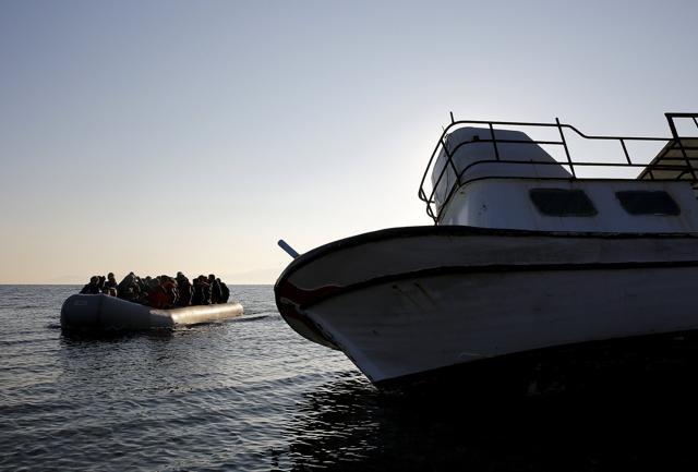 A raft overcrowded with migrants and refugees approaches a beached boat at dawn, past a sanken wooden boat used by refugees on the Greek island of Lesbos. Many fear Paris attacks will have an adverse impact on refugees, with European nations now wary of allowing asylum-seekers escaping war and conflict. (Reuters Photo) A raft overcrowded with migrants and refugees approaches a beached boat at dawn, past a sanken wooden boat used by refugees on the Greek island of Lesbos. Many fear Paris attacks will have an adverse impact on refugees, with European nations now wary of allowing asylum-seekers escaping war and conflict. (Reuters Photo)