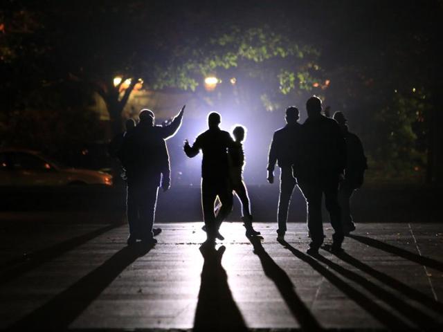 Residents are evacuated by the police in Saint Denis, north of Paris. Authorities in the Paris suburb of Saint Denis were telling residents to stay inside during a large police operation near France's national stadium that two officials said was linked to last week's deadly attacks. (AP Photo)