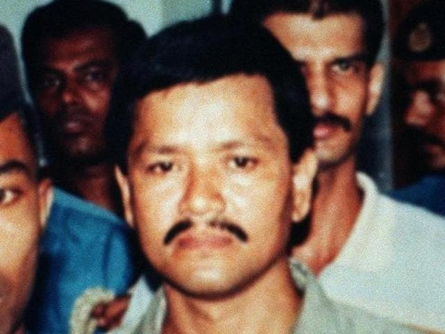 Rebel group United Liberation Front of Assam (Ulfa) leader Anup Kumar Chetia (2nd R) is handcuffed along with his two accomplices Babul Sharma (L) and Luxmi Prashad (C) as they arrive at a Bangladeshi court in Dhaka.(AFP File Photo) Rebel group United Liberation Front of Assam (Ulfa) leader Anup Kumar Chetia (2nd R) is handcuffed along with his two accomplices Babul Sharma (L) and Luxmi Prashad (C) as they arrive at a Bangladeshi court in Dhaka.(AFP File Photo)