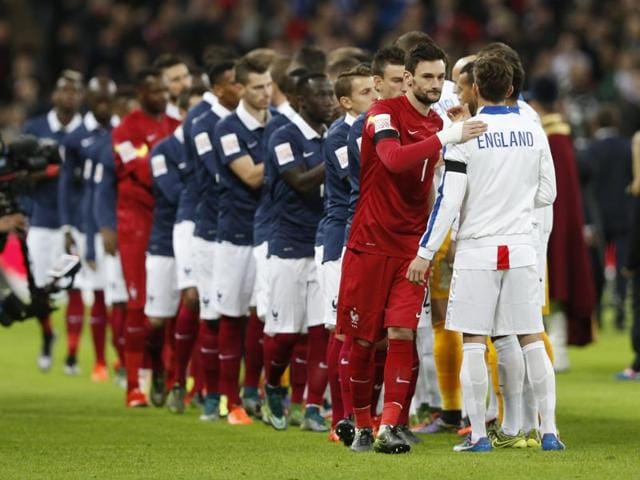 England and France players stand together and observe a minute’s silence in honour of the Paris attacks’ victims ahead of the start of their friendly at the Wembley on November 17. (AP Photo) England and France players stand together and observe a minute’s silence in honour of the Paris attacks’ victims ahead of the start of their friendly at the Wembley on November 17. (AP Photo)