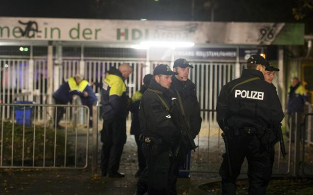 Armed security personnel stand in front of the stadium after the match was called off due to a security threat. (REUTERS) Armed security personnel stand in front of the stadium after the match was called off due to a security threat. (REUTERS)