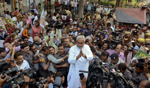 Chief Minister Nitish Kumar, is surrounded by media personnel as he greets supporters after victory in Bihar elections in Patna on November 8. (AP) Chief Minister Nitish Kumar, is surrounded by media personnel as he greets supporters after victory in Bihar elections in Patna on November 8. (AP)
