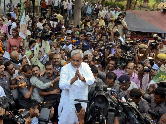 Bihar chief minister Nitish Kumar is surrounded by journalists as he greets supporters after victory in the state assembly elections. (AP) Bihar chief minister Nitish Kumar is surrounded by journalists as he greets supporters after victory in the state assembly elections. (AP)