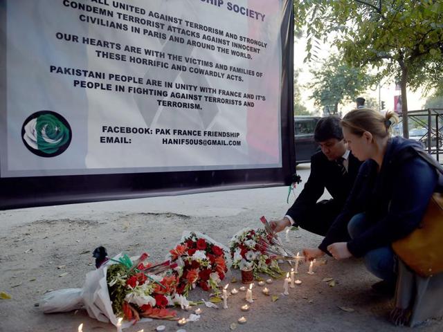 Members of the Pak-France Friendship Society place candles during a vigil to pay tribute to victims of the Paris attacks claimed by Islamic State. (AFP) Members of the Pak-France Friendship Society place candles during a vigil to pay tribute to victims of the Paris attacks claimed by Islamic State. (AFP)