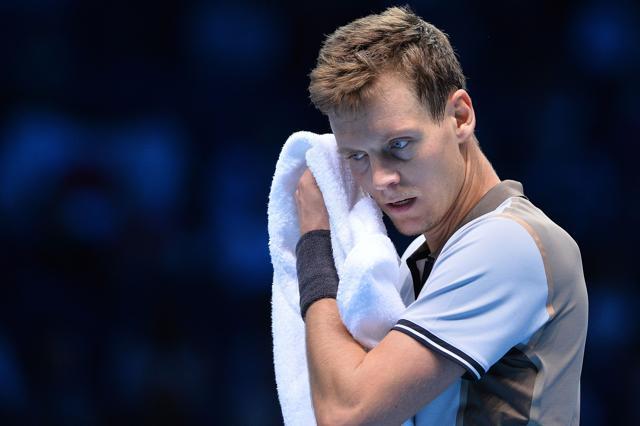 Tomas Berdych takes to the towel after a long point. (AFP)