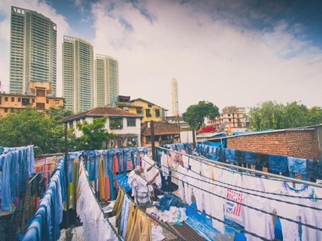 The contrast in the city: Mumbai (the highrises in the background) and the old city of Bombay (tile-roofed, small buildings in the foreground)  (Photo: Vipul Prasad) 