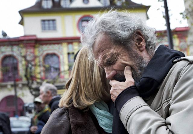 Jean-Marie de Peretti mourns the loss of his 33-year-old daughter Aurelie, one of the victims of the attack on the Bataclan concert hall, in the background. (AP) Jean-Marie de Peretti mourns the loss of his 33-year-old daughter Aurelie, one of the victims of the attack on the Bataclan concert hall, in the background. (AP)