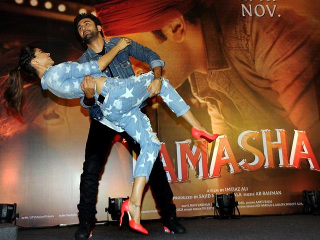 Oh, it’s fun and the job’s half done! Ranbir Kapoor and Deepika Padukone at the promotional event for Tamasha. (AFP)