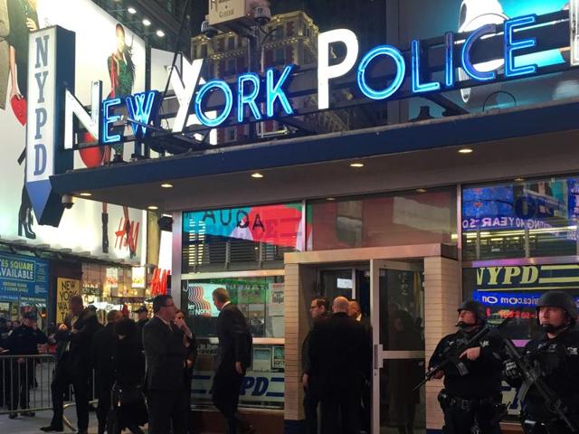 Police officers stand guard in Times Square, New York. The New York Police Department said it is aware of recently-released video by the Islamic State but there is no current or specific threat to the city. (AP Photo)