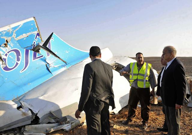 In this file photo, Egyptian Prime Minister Sherif Ismail, right, looks at the remains of a crashed Russian passenger jet in Hassana, Egypt. (AP) In this file photo, Egyptian Prime Minister Sherif Ismail, right, looks at the remains of a crashed Russian passenger jet in Hassana, Egypt. (AP)