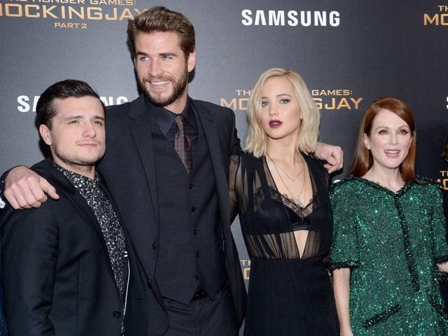 Josh Hutcherson, Liam Hemsworth, Jennifer Lawrence and Julianne Moore attend a special screening of The Hunger Games: Mockingjay Part 2. (AP)
