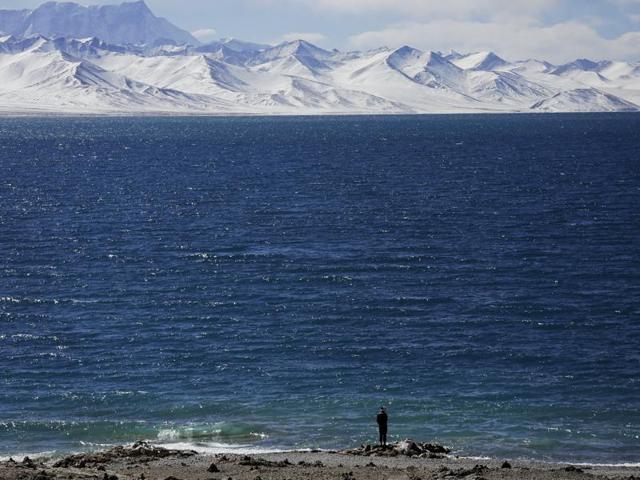 A man stands at shores of Namtso lake. (REUTERS)