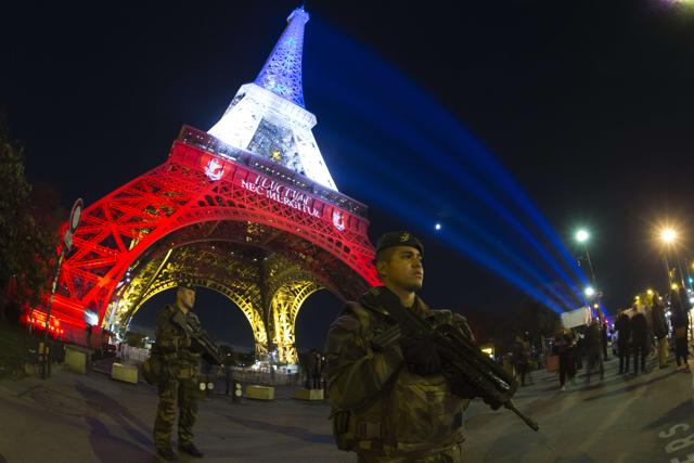 The Eiffel Tower illuminated with the colours of the French national flag in tribute to the victims of the November 13 Paris terror attacks. (AFP Photo) The Eiffel Tower illuminated with the colours of the French national flag in tribute to the victims of the November 13 Paris terror attacks. (AFP Photo)