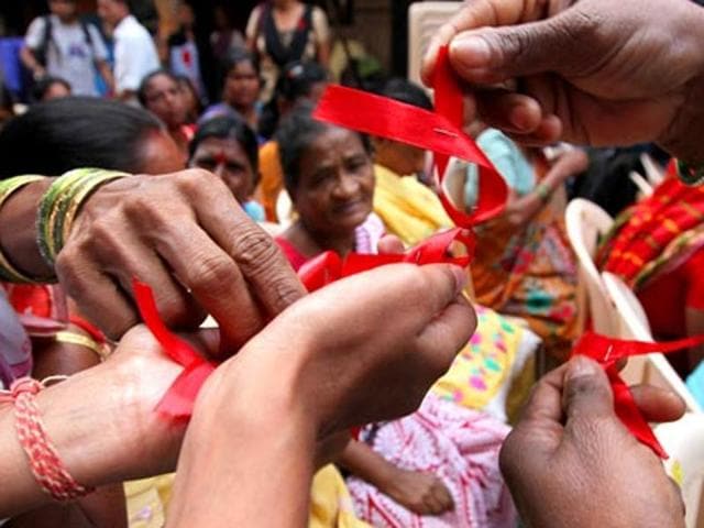 Sex workers distribute red ribbons, symbol of the fight against AIDS, in a rally on World Aids Day in Mumbai. For the first time, a group will demand legal rights.(Vijayanad Gupta/ HT photo) Sex workers distribute red ribbons, symbol of the fight against AIDS, in a rally on World Aids Day in Mumbai. For the first time, a group will demand legal rights.(Vijayanad Gupta/ HT photo)
