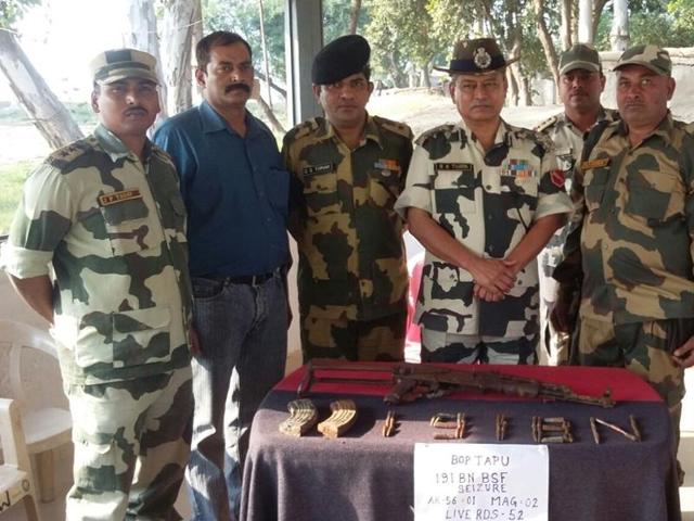 Border Security Force personnel along with seized ammunition. (HT Photo) Border Security Force personnel along with seized ammunition. (HT Photo)