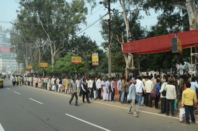 People outside Patna’s Gandhi Maidan ahead of the oath-taking ceremony. (Santosh Kumar/HT Photo)