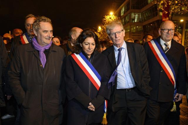 (From L) Aubervilliers mayor Pascal Beaudet, Paris mayor Anne Hidalgo, former Saint-Denis mayor Patrick Braouezec and current Saint-Denis mayor Didier Paillard arrive to attend a homage ceremony outside Paris. (AFP Photo) (From L) Aubervilliers mayor Pascal Beaudet, Paris mayor Anne Hidalgo, former Saint-Denis mayor Patrick Braouezec and current Saint-Denis mayor Didier Paillard arrive to attend a homage ceremony outside Paris. (AFP Photo)