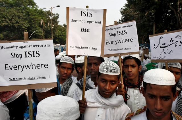 Activists from a Muslim group hold placards during a protest rally against the Paris attacks, in Kolkata. (REUTERS)