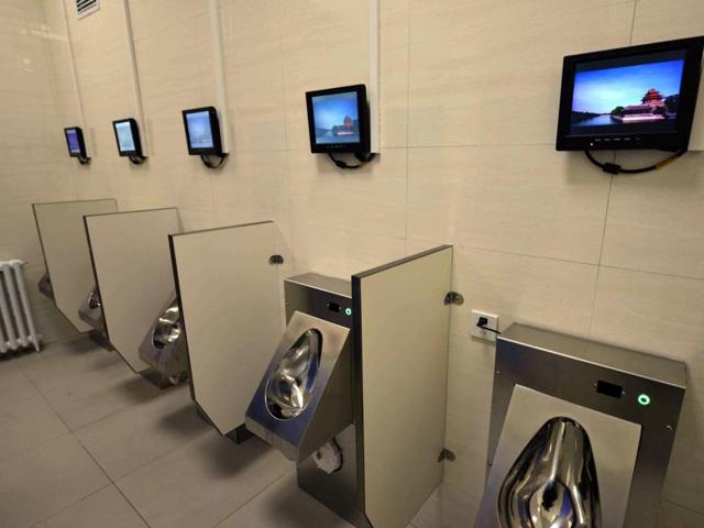 This is the public toilet equipped with Wi-Fi, a bank ATM machine and chargers for mobile phones and electric vehicles in Beijing. (AFP) This is the public toilet equipped with Wi-Fi, a bank ATM machine and chargers for mobile phones and electric vehicles in Beijing. (AFP)