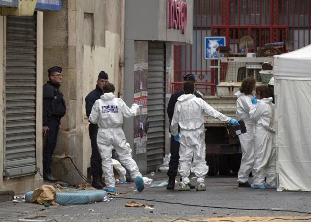 Investigating police officers are pictured outside Saint Denis, near Paris, Thursday, Nov. 19, 2015. The Paris prosecutor says that the suspected mastermind of the Paris attacks, Abdelhamid Abaaoud, was killed in Wednesday's police raid in the building. (AP Photo) Investigating police officers are pictured outside Saint Denis, near Paris, Thursday, Nov. 19, 2015. The Paris prosecutor says that the suspected mastermind of the Paris attacks, Abdelhamid Abaaoud, was killed in Wednesday's police raid in the building. (AP Photo)