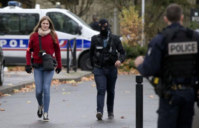 Police officers walk outside the house of the mother of the female suicide bomber Hasna Aitboulahcen, in Aulnay-sous-Bois, near Paris. Aitboulahcen is believed to have detonated a suicide vest after a brief exchange with police officers. (AP Photo) Police officers walk outside the house of the mother of the female suicide bomber Hasna Aitboulahcen, in Aulnay-sous-Bois, near Paris. Aitboulahcen is believed to have detonated a suicide vest after a brief exchange with police officers. (AP Photo)