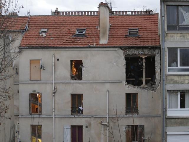 People work inside the damaged building of Wednesday's raid on an apartment in the Paris suburb of Saint-Denis, Thursday Nov.19, 2015. A third body was found at the site of the police raid on Friday, November 20, 2015. (AP) People work inside the damaged building of Wednesday's raid on an apartment in the Paris suburb of Saint-Denis, Thursday Nov.19, 2015. A third body was found at the site of the police raid on Friday, November 20, 2015. (AP)