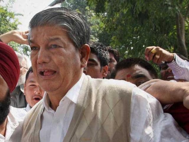 “I am deeply pained by the news item,” an official release quoted Harish Rawat as saying.(PTI photo)