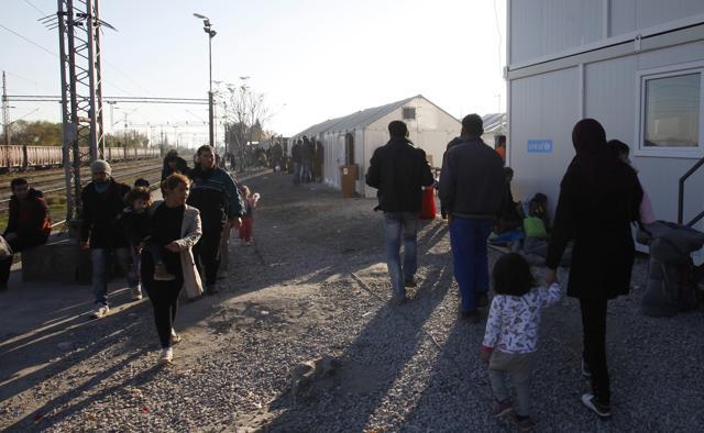 Migrants and refugees walk through the transit center for refugees near a border village in northern Macedonia. French PM said the Paris attackers took advantage of the refugee crisis to slip in to France. (AP) Migrants and refugees walk through the transit center for refugees near a border village in northern Macedonia. French PM said the Paris attackers took advantage of the refugee crisis to slip in to France. (AP)