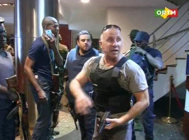 In this TV image taken from Mali TV ORTM, a security officer gives instructions to other security forces inside the Radisson Blu Hotel in Bamako. (AP Photo) In this TV image taken from Mali TV ORTM, a security officer gives instructions to other security forces inside the Radisson Blu Hotel in Bamako. (AP Photo)