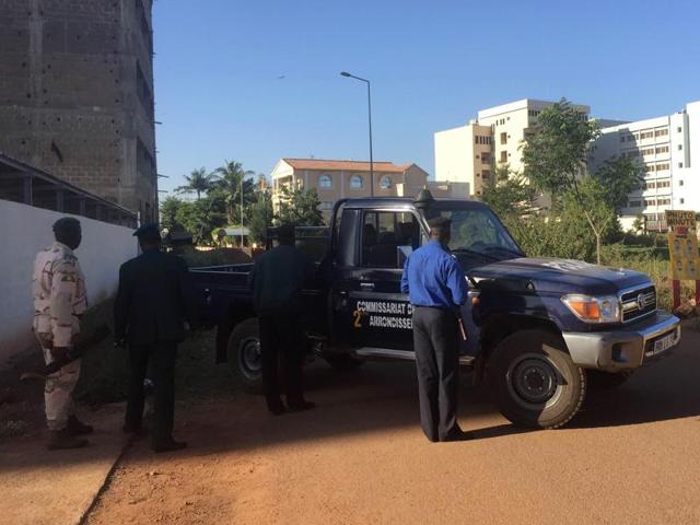 Malian security forces take position near the Radisson Blu hotel. Automatic weapons fire could be heard from outside the 190-room hotel, where government forces have set up a security cordon. (AFP)