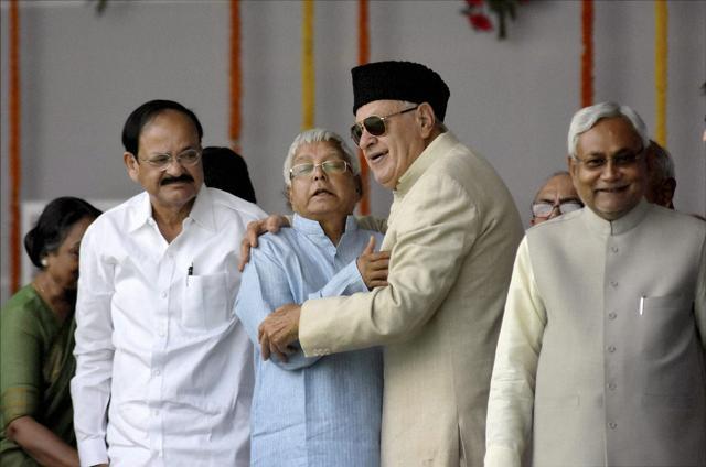 Bihar chief minister Nitish Kumar, RJD chief Lalu Prasad, former Union minister Farooq Abdullah and Union minister of urban development Venkaiah Naidu during the swearing-in ceremony of the new government at Gandhi Maidan in Patna on Friday. (PTI) Bihar chief minister Nitish Kumar, RJD chief Lalu Prasad, former Union minister Farooq Abdullah and Union minister of urban development Venkaiah Naidu during the swearing-in ceremony of the new government at Gandhi Maidan in Patna on Friday. (PTI)