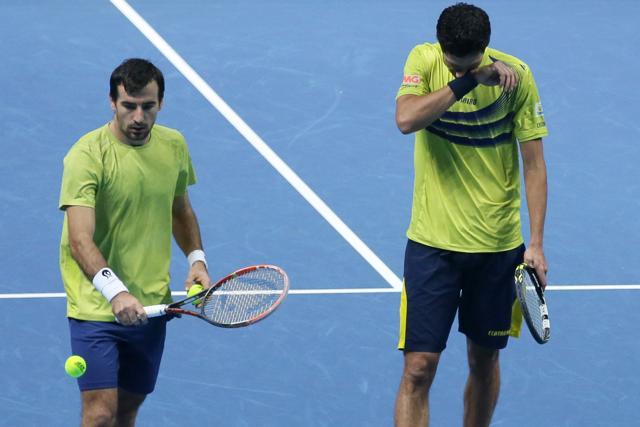 Ivan Dodig, left, and Marcelo Melo look dejected after losing a point. (AP Photo) Ivan Dodig, left, and Marcelo Melo look dejected after losing a point. (AP Photo)