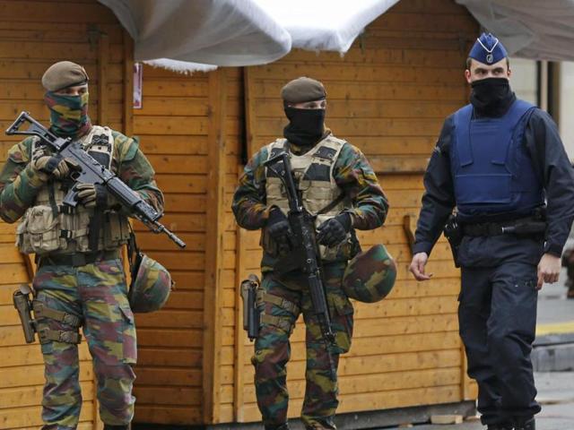 Belgian soldiers and a police officer patrol in central Brussels after security was tightened following the fatal attacks in Paris. (REUTERS) Belgian soldiers and a police officer patrol in central Brussels after security was tightened following the fatal attacks in Paris. (REUTERS)