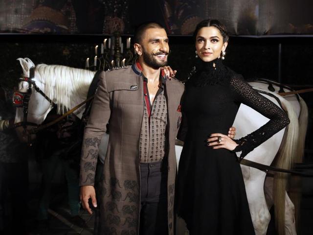 Ranveer Singh and Deepika Padukone strike a pose for photographers during a trailer launch of Bajirao Mastani in Mumbai on Friday, Nov. 20, 2015. (AP)