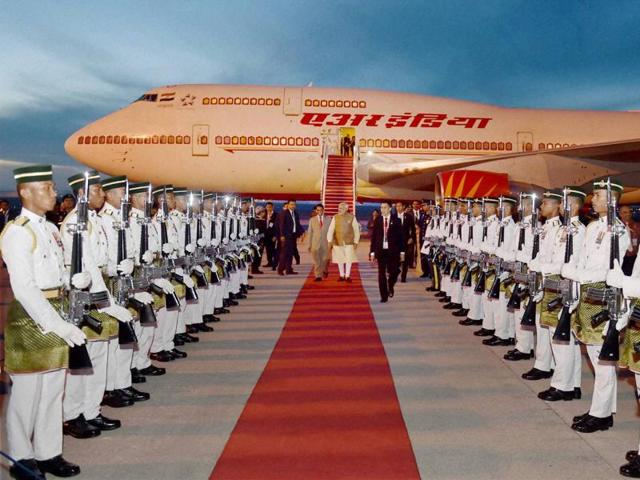 PM Modi inspects a guard of honour on his arrival at Bunga Raya Kuala Lumpur International Airport in Malaysia. (PTI)