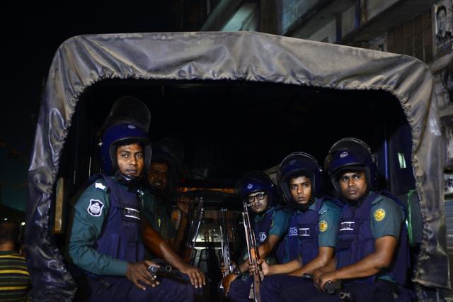 Bangladeshi police officers stand guard in Dhaka's Central Jail. (AFP Photo)