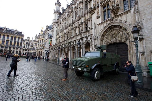 People posing for pictures in front of a military armoured vehicle next to the Grande Place square in central Brussels. (AFP) People posing for pictures in front of a military armoured vehicle next to the Grande Place square in central Brussels. (AFP)