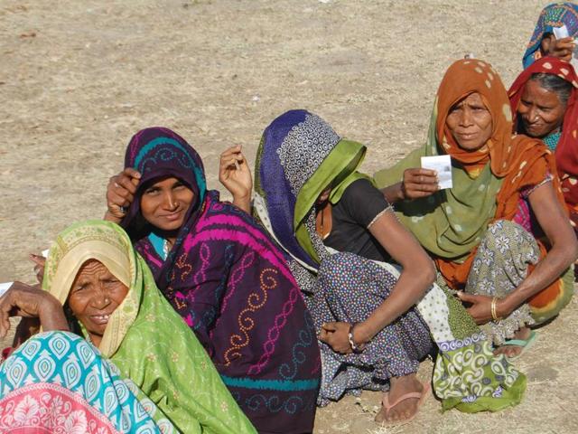 Woman voters form a queue outside a polling booth in Jhabua district on Saturday. Woman voters form a queue outside a polling booth in Jhabua district on Saturday.