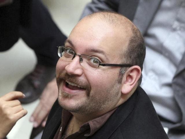 In this photo Jason Rezaian, an Iranian-American correspondent for the Washington Post, smiles as he attends a presidential campaign of President Hassan Rouhani in Tehran. Iran has sentenced detained Washington Post journalist Jason Rezaian to an unspecified prison term following his conviction last month on charges that include espionage. (AP Photo) In this photo Jason Rezaian, an Iranian-American correspondent for the Washington Post, smiles as he attends a presidential campaign of President Hassan Rouhani in Tehran. Iran has sentenced detained Washington Post journalist Jason Rezaian to an unspecified prison term following his conviction last month on charges that include espionage. (AP Photo)