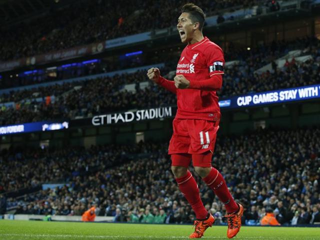 Liverpool’s Roberto Firmino celebrates with teammate Philippe Coutinho after Manchester City's Eliaquim Mangala scores an own goal during the EPL match at the Etihad Stadium on November 21, 2015. (AP Photo) Liverpool’s Roberto Firmino celebrates with teammate Philippe Coutinho after Manchester City's Eliaquim Mangala scores an own goal during the EPL match at the Etihad Stadium on November 21, 2015. (AP Photo)