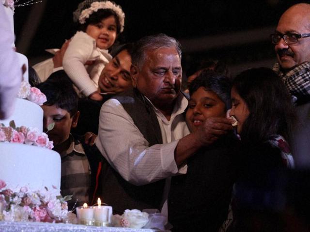 Samajwadi Party supremo Mulayam Singh Yadav with Amar Singh celebrate his 77th birthday in Saifai on Saturday. (PTI Photo)