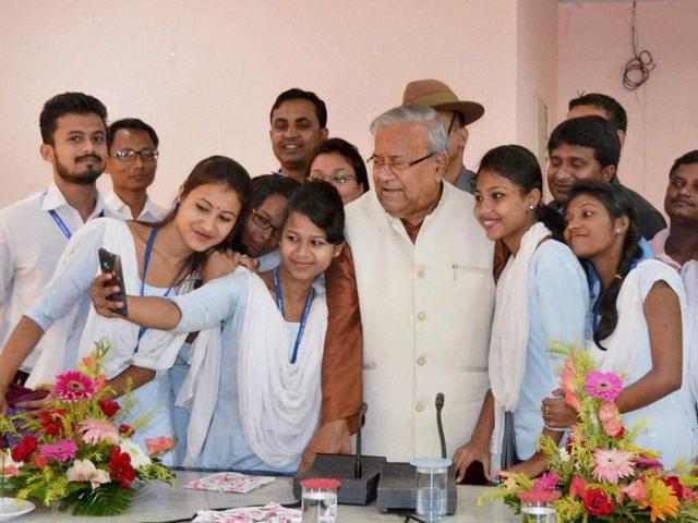 Students take selfie with Assam Governor PB Acharya at Circuit House, in Nagaon District of Assam.(PTI File Photo)