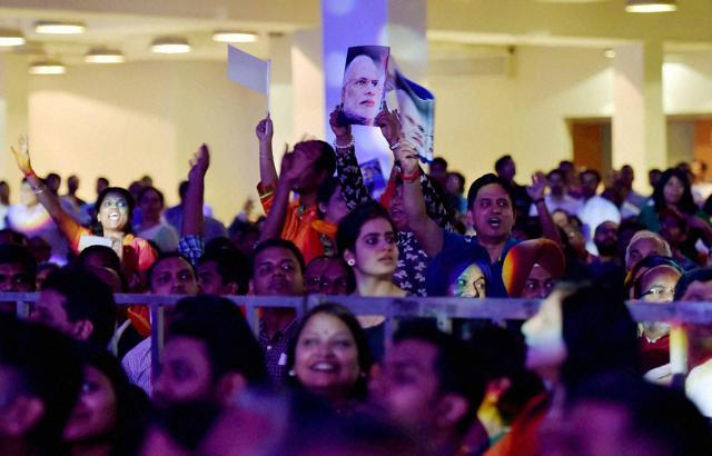 People from Indian community cheer up for Prime Minister Narendra Modi during an event in Kuala Lumpur, Malaysia on Sunday . (PTI) People from Indian community cheer up for Prime Minister Narendra Modi during an event in Kuala Lumpur, Malaysia on Sunday . (PTI)