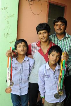 Wrestler Neetu with her husband Sanjay and twin sons Prince and Ayush. (Sanjeev Sharma/HT Photo)