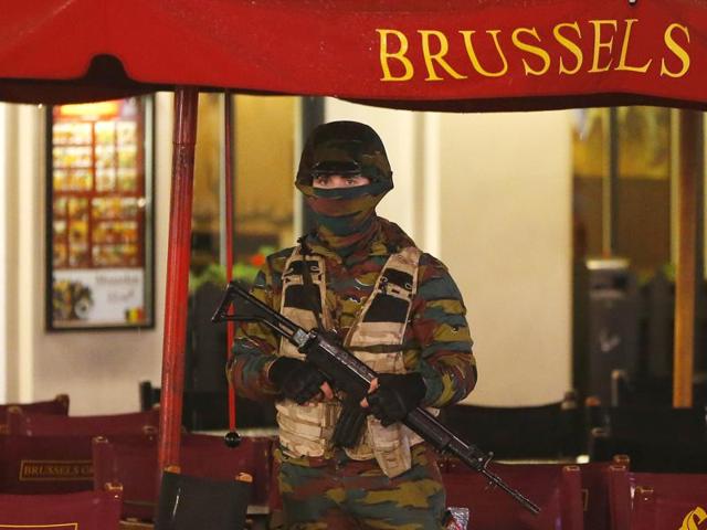 A Belgian soldier stands guard outside a cafe near Brussels' Grand Place. (REUTERS) A Belgian soldier stands guard outside a cafe near Brussels' Grand Place. (REUTERS)